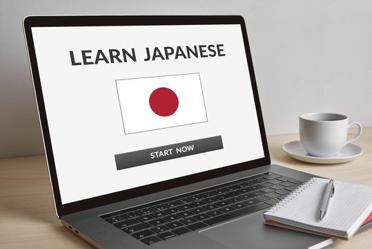 Learn Japanese concept on modern laptop computer screen on wooden table. All screen content is designed by me.