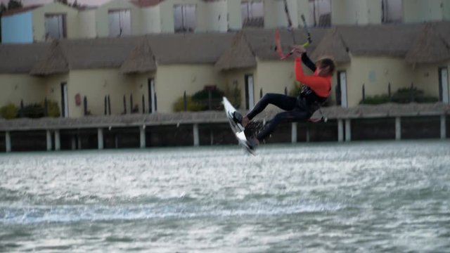 Man Kitesurfing In Ocean In Summer Does Extreme trick failed
