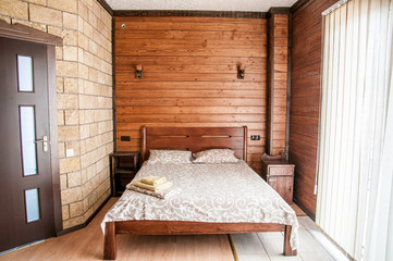 Comfort bedroom in luxury style. Scandinavian style stone and natural wood