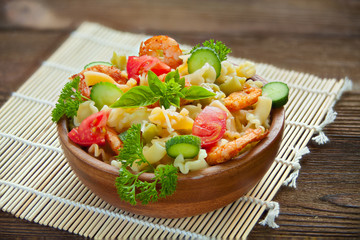  delicious gigli t with shrimps and basil on  plate