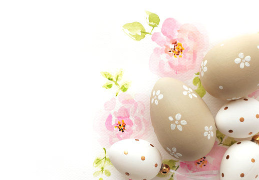 easter eggs and watercolor flowers on white background