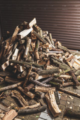 pile of firewood lies in yard