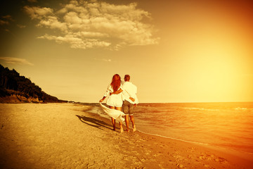 Two lovers on beach and sunset time 