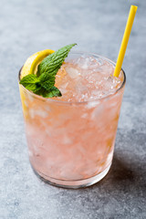 Pink Cocktail with Crushed Ice, Mint and Lemon