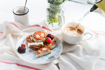 syrniki with poppy seeds on a wooden surface. concept of a healthy breakfast