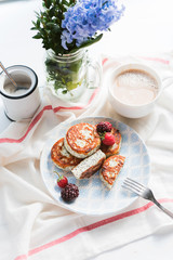 syrniki with poppy seeds on a wooden surface. concept of a healthy breakfast