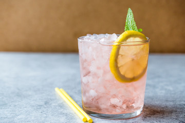 Pink Cocktail with Crushed Ice, Mint and Lemon