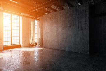 Bright light streaming into empty warehouse room