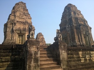 Fototapeta na wymiar Angkor Wat in Siem Reap, Cambodia. Ancient Khmer stone temple ruins in jungle forest