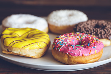 Homemade colorful donuts close up