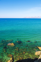 Fototapeta na wymiar Rocky coast in summer in Sicily, Italy