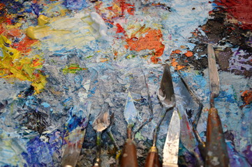 A painter's palette in his workshop with tools
