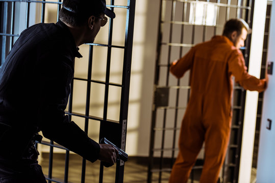 police guard pursuing escaping prisoner with gun