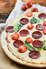 Tasty Pizza With Tomato Sauce, Pepperoni Sausage, And Mushrooms On Wooden Background Natural Rustic, A Pizza Cutter And Ingridienty.