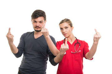 Lady doctor and male patient both showing obscene gesture.