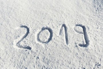 2019 new year written on snow