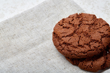 Stack of Chocolate chip cookies on wooden background. Stacked chocolate chip cookies shot with selective focus.