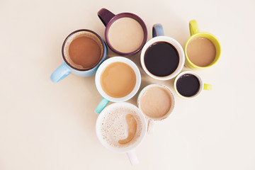 Mugs with hot caffeinated drinks. Good morning concept