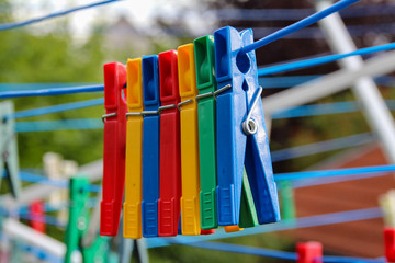 Close up of a colored clothespins on a clothesline