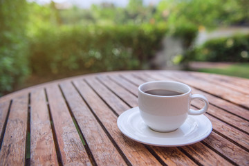 Hot coffee on wooden table