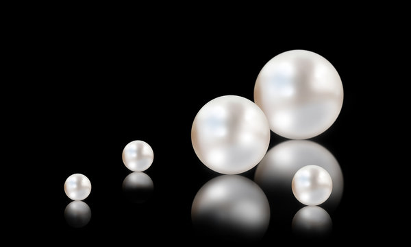 Many small and big white pearls on white and black background