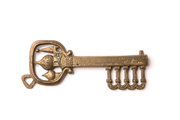 Antique gold key isolated on white background