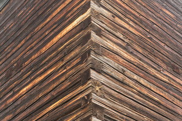 A corner of the wall of the old log house.