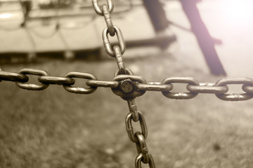 Obraz premium Chains connected by a screw