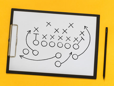 American football strategy, coaching, training. Game strategy. Scheme of the game on a sheet of paper