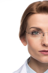 Close-up view of confident female doctor wearing glasses isolated on white