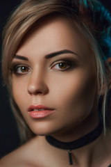 Close-up portrait of brunette woman with paper choker