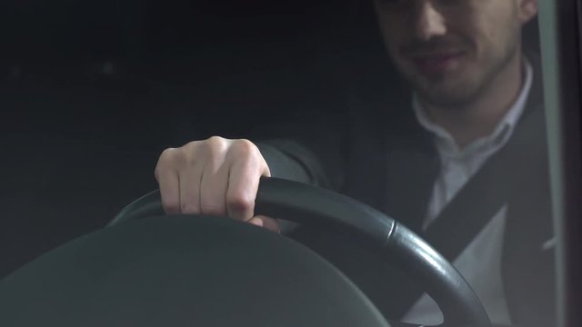 Portrait Closeup Of Pleased Smiling Man 30s In Formal Wear Driving His Car On Road, Or Being Stuck In Traffic Jam