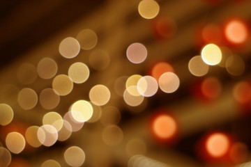 Abstract blurred interior decorated lighting in brown and orange color gradations 