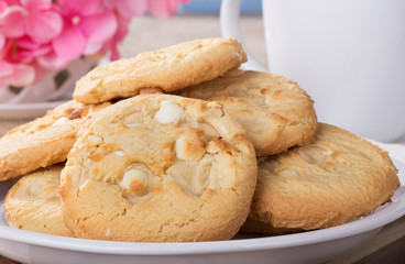 Closeup of  white chocolate macadamia nut cookies on a plate