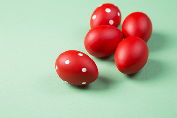 easter eggs on green background in top view