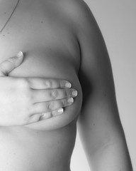 Woman with hands on breasts black and white / Outubro Rosa