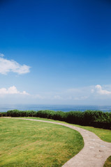 Grass meadow with summer blue sky cape at Jogashima island, Miura, Japan. Blue sea ocean view