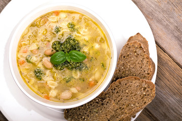 Minestrone with fresh pesto and brown seeded bread.