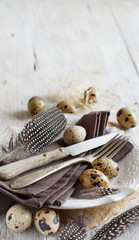 Easter table setting with quail eggs