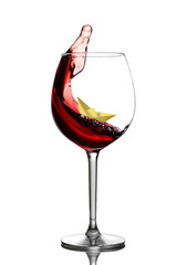 Paper ship in a glass with wine isolate