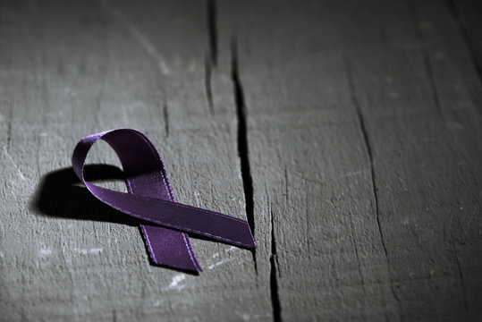 purple ribbon against the violence against women
