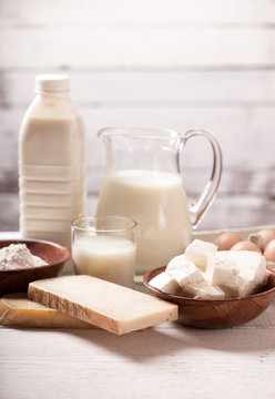 Milk and dairy products on wooden table