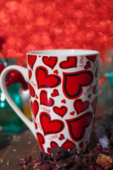 Romantic gift for the beloved for Valentine's Day all lovers holiday hot tea hibiscus in a mug with hearts