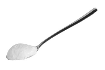 Metal spoon with sour cream isolated, black and white photo