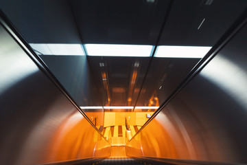 Motion blurred view of a moving escalator