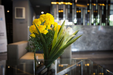 vase of marigold in lobby