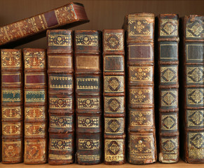 old books on wooden shelf.