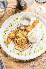 grilled roasted bbq chicken on wooden table with fried broccoli dip and wine