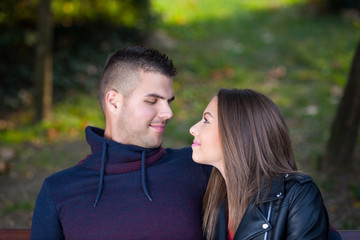 Fototapeta premium A young couple hugging in the park.