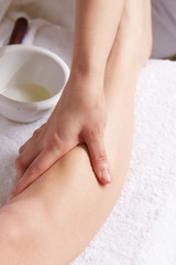 Obraz na płótnie Canvas Female Enjoying Relaxing legs Massage In Cosmetology Spa Center